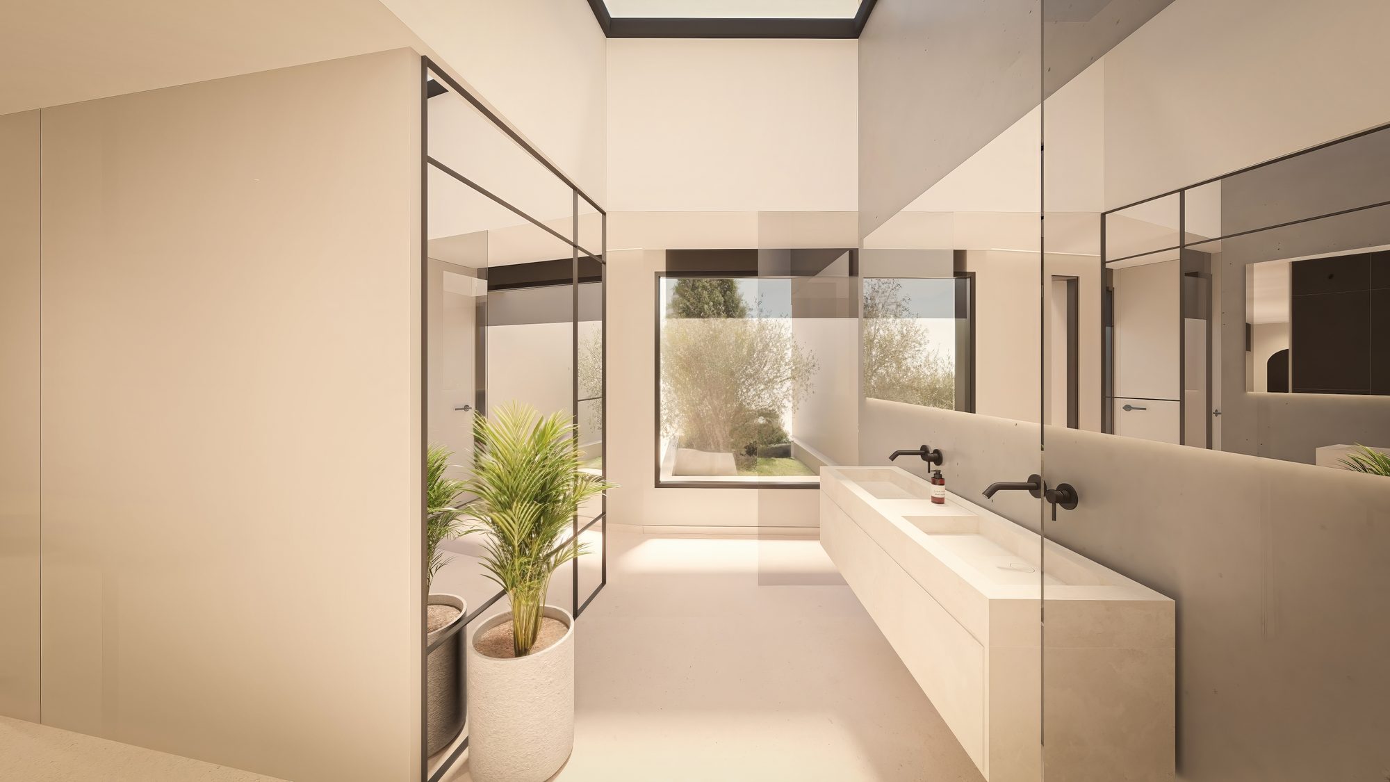 Baño de la suite con doble lavabo y lucernario en la villa de Roca Llisa